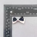Navy blue polka dot bow hair accessory with white satin base and pink ribbon accent - Blue Beige Pink Binding Polka Dot (23)