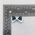 Polka dot bow in blue and black colors for hair accessories with ruler measuring size - Blue Black Polka Dot Bow (62)