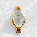 Macro view of gold quartz watch dial with silver sunray pattern and metal markers - Sunray Dial Artistic Numeral Oval Style (BARSH) / White