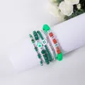 Detailed close-up of 5-piece green beaded bracelet set with BELIEVE letter beads - Believe Dark Green