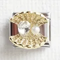 Detailed close-up of a golden seashell charm with crystal and pearl on a steel link - Shell