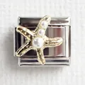Detailed macro view of a stainless steel Italian charm link with gold starfish and pearls - Starfish
