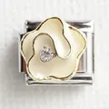 Detailed macro view of a floral Italian charm link with white enamel and golden frame - Gold Trim White Flower
