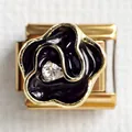 Detailed macro view of a gold-trimmed black enamel rose charm with a central zircon inlay - Black Flower 2 (Black Rose Zirconia)