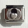 Macro detail of stainless steel Italian charm link with winged heart textured pattern - Heart Wings