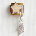 Macro detail of Italian gold charm with white enamel star and shimmering rhinestone pendant - Shooting Star