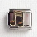 Macro shot of silver stainless steel Italian charm link with a gold music note icon - Note 1
