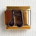 Detail of 304 stainless steel Italian charm link with gold finish and music note motif - Note 1