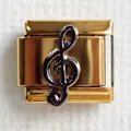 Detailed macro view of a gold Italian charm featuring a black treble clef music symbol - Music Note 2 (Treble Clef)