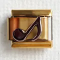 Macro detail of gold 304 stainless steel Italian charm featuring a black music note motif - Note 3