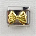 Close-up of Italian charm link with golden 3D bow design on stainless steel base - Gold Bowknot (0025-2)