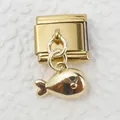 Detailed view of Italian charm link featuring a polished gold fish pendant on white texture - Fish Whale Style (7)