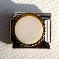 Macro view of Italian charm link featuring iridescent mother of pearl with gold gear border - Iridescent Mother of Pearl