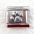 Detailed macro view of 9mm stainless steel Italian charm with embossed silver paw print - Paw Print (6)