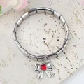 Macro shot of stainless steel Italian charm bracelet with a red gemstone bow pendant - Silver Red Rhinestone