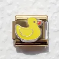 Macro shot of gold stainless steel Italian charm featuring a cute yellow duck design - Yellow Duck