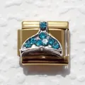 Macro view of gold stainless steel Italian charm with blue rhinestone whale tail detail - Fish Tail