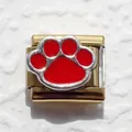 Close-up of golden Italian charm link with red enamel paw print for modular bracelets - Paw