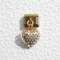 Macro shot of gold heart charm with clear crystals on Italian modular bracelet link - Zirconia Pave Heart Style