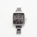 Macro shot of a silver square women's watch with Roman numerals and steel link strap - Square Sunray Black Dial Roman Numerals Style