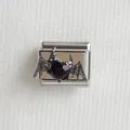 Macro detail of gothic bat wings and black heart gem on stainless steel Italian charm - Bat