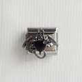 Macro shot of Italian charm link featuring gothic bat wings and a black heart gem - Bat Heart Style 2