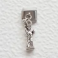 Macro view of stainless steel Italian charm link featuring a detailed Statue of Liberty - Statue of Liberty