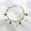 Gouden ketting met witte schelphangers en groene kralen voor een zomerse look - Groen Fruit Armband