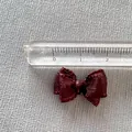 Macro detail of 2cm mini burgundy ribbon bow accessory with ruler for scale - Dark Maroon