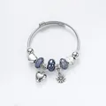 Silver beaded bracelet with blue glass beads, sunflower charm, heart pendant, and clock charm - Silver Purple Style