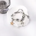 Pulsera navideña con colgantes de copos de nieve y cuentas de colores en piedra - Estilo Gato Estrella de Mar Dorado