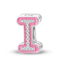 Macro shot of pink enamel alphabet I charm with zircon stones for DIY bracelets - Letter I
