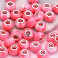 Close-up of pink and white marble resin large hole beads for DIY bracelet jewelry making - Pink Marble Style(1)