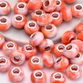 Macro detail of orange marble resin beads with metal core for DIY jewelry making - Orange White Marble(3)