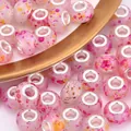Macro detail of pink resin beads with splash ink patterns and silver metal core - Pink Base Red Orange Yellow Splash (4)