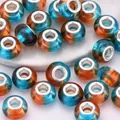 Macro shot of colorful acrylic resin beads with swirl patterns and metal core for DIY - Blue Orange Gradient (11)