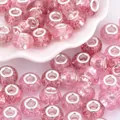 Macro shot of pink glitter resin beads with large metal holes for DIY jewelry - Pink Glitter (4)