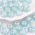 Cuentas de resina azul claro con acabado brillante y núcleo de plata para pulseras DIY - Azul claro