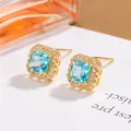 Elegant gold square aquamarine cubic zirconia stud earrings with halo setting for women - Blue