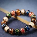Macro shot of colorful glass beads with gold foil texture and a vintage jewelry aesthetic - Plain Multicolor Beads