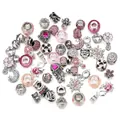 Detailed macro of pink glass charms and silver heart pendant with Best Mom engraving - 50 Pieces Set / Pink