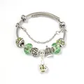 Silver snake chain bracelet with faceted green glass beads and crown charms - Green