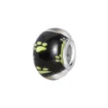 Close-up of black resin big hole bead featuring fluorescent green animal paw prints - Normal Specification / Yellow