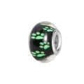 Macro detail of black resin charm bead with bright green animal paw prints and silver core - Normal Specification / Green