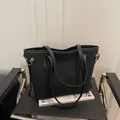 Minimalist black tote bag in matte PU leather with gold ring hardware and drawstring detail - No Pendant / Black