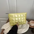 Quilted bright yellow nylon pouch with soft puffer square texture and black zipper - Yellow