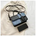Kleine quadratische Tasche mit schwarzem Leder und blauem Denim-Patchwork-Design - Schwarz