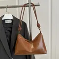 Brown vintage faux leather tote bag with unique knotted strap and zipper closure - Brown