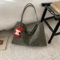 Olive green large capacity suede tote bag featuring a red apple core plush charm - With Pendant / Green