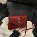Vintage burgundy faux crocodile leather crossbody bag with gold horseshoe clasp - Red Without Charm